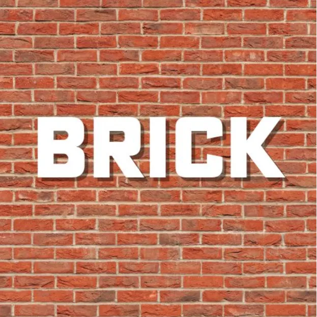 White “BRICK” text on a red brick wall background