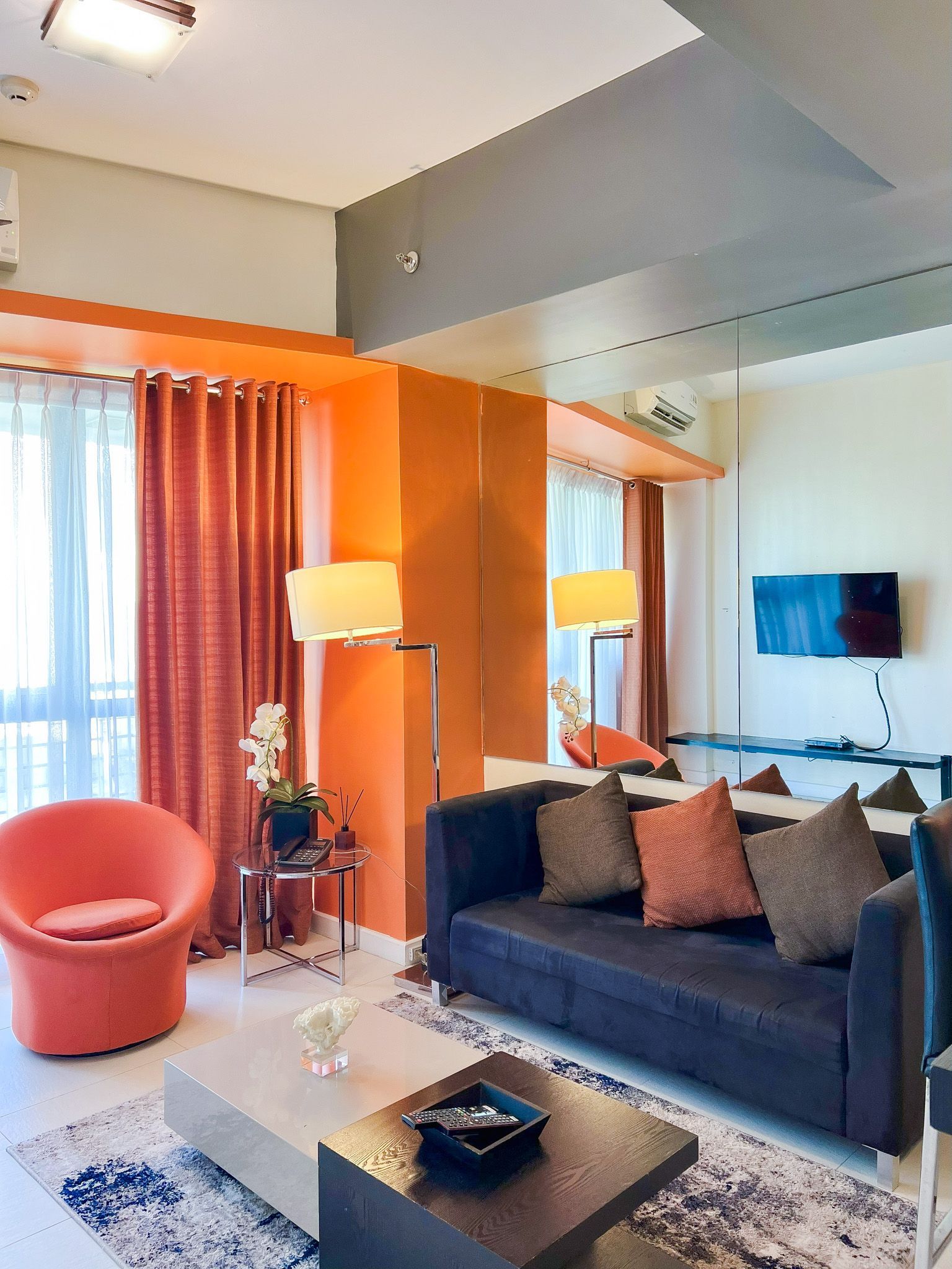 Elegant dining setup with modern kitchenette, ideal for hotels in Makati