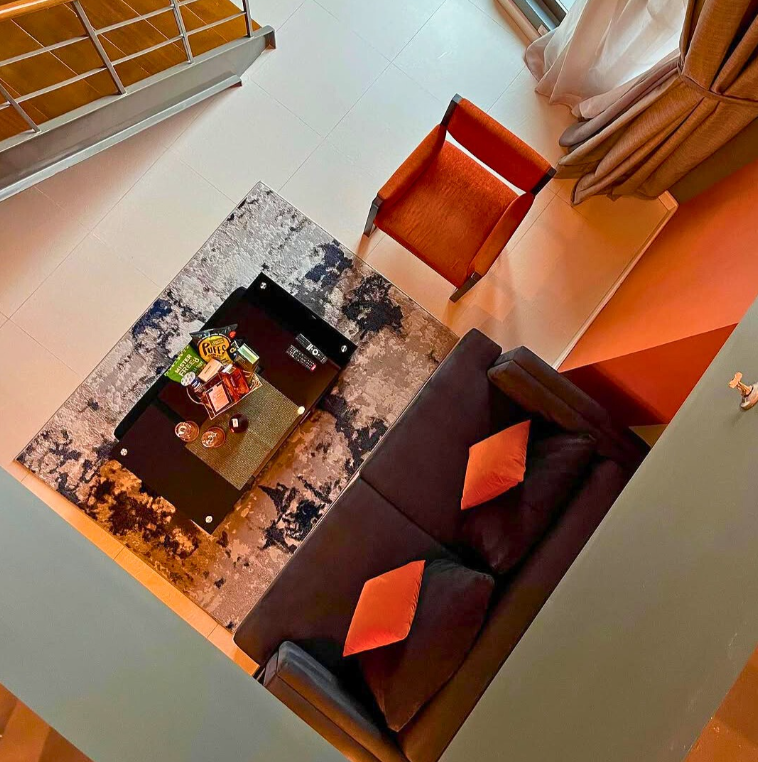Cozy dining area with orange accents and modern furnishings