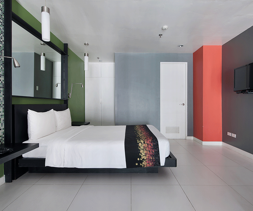Modern hotel room with king bed at KL Serviced Residences Makati