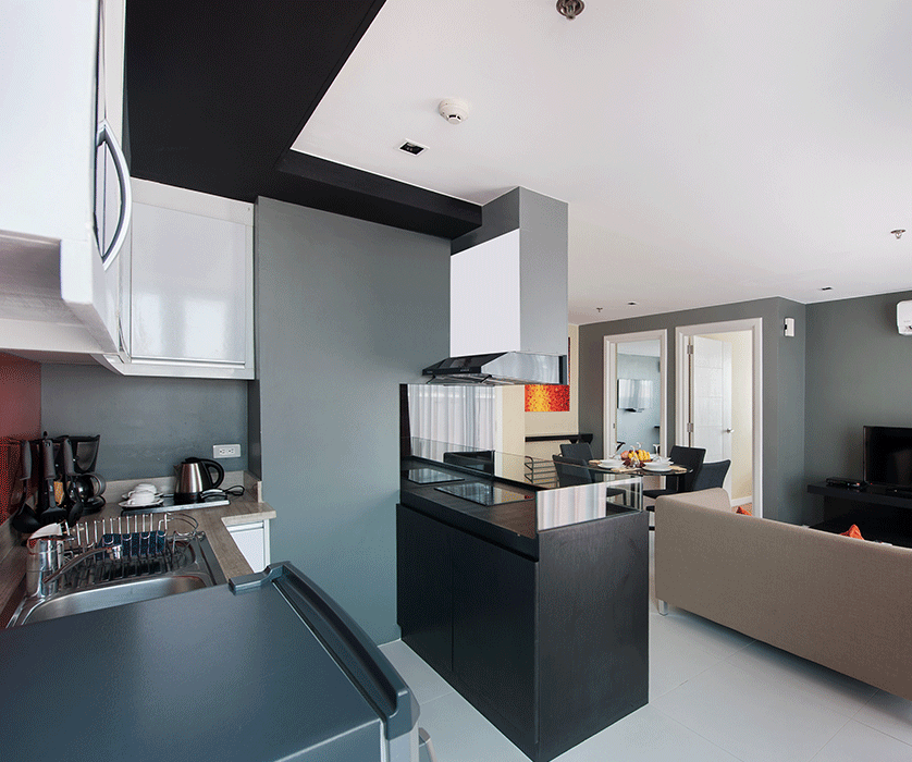 Modern open-plan kitchen and living area at KL Serviced Residences Makati