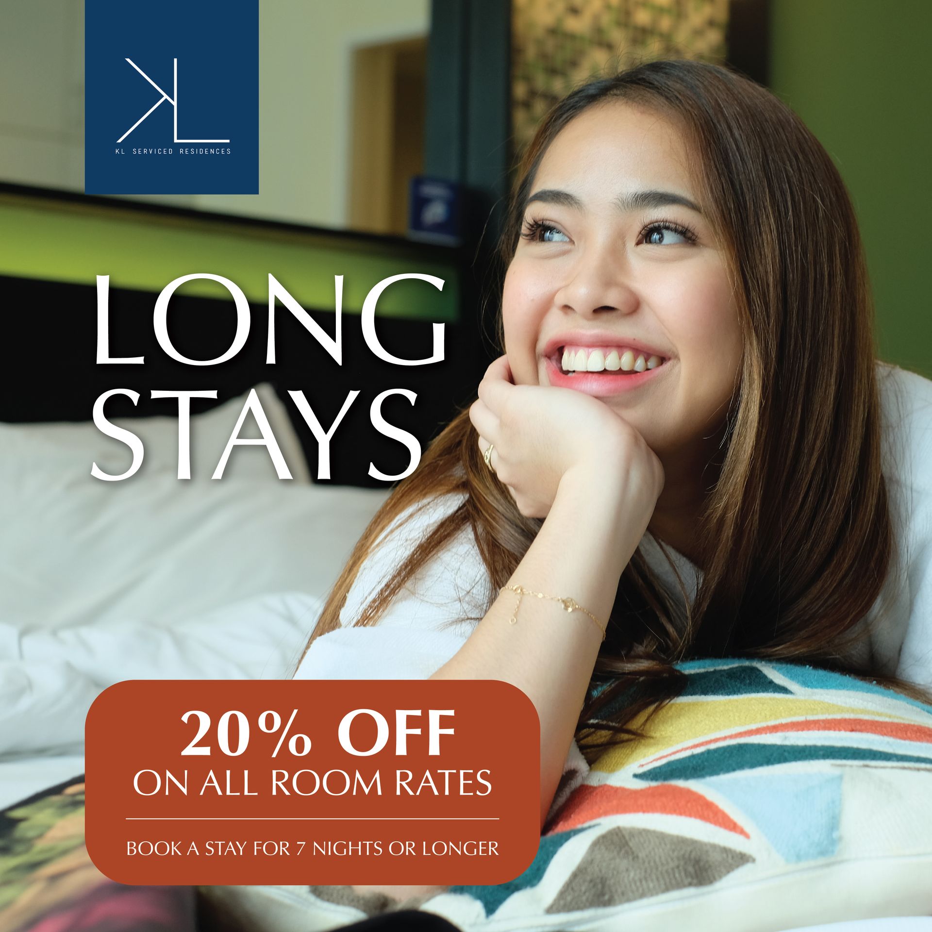 Woman relaxing during a long stay at a Makati hotel with 20% off room rates for 7+ night bookings.