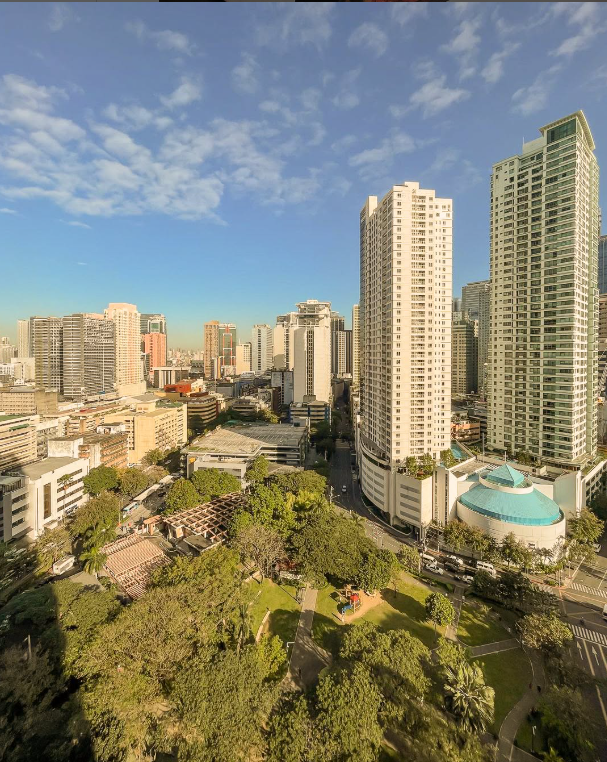 Breathtaking view of the city skyline from a hotel near Greenbelt, showcasing urban landscape