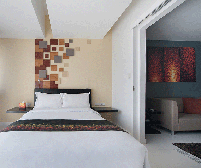 Spacious hotel room with modern decor at KL Serviced Residences Makati