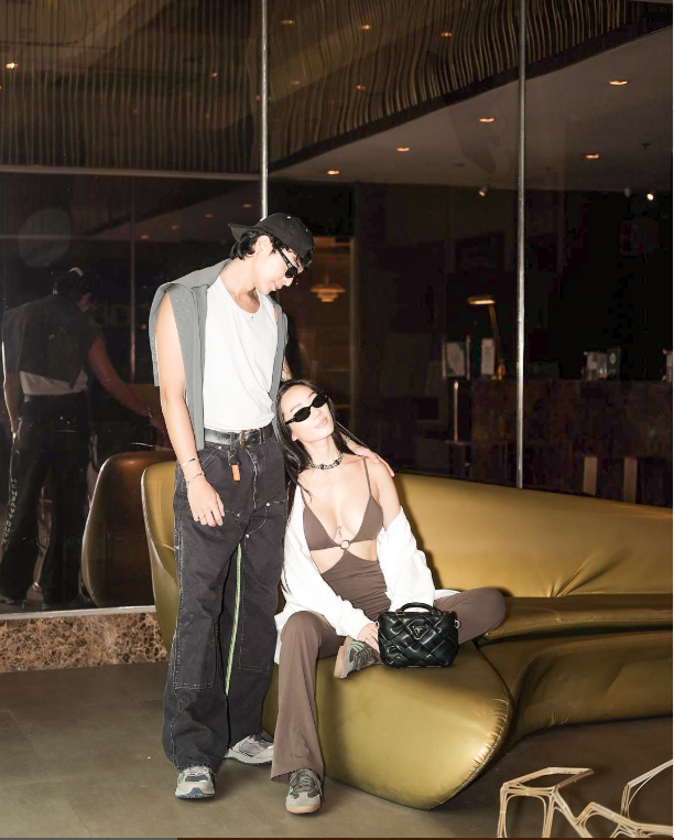 Stylish couple posing at KL Serviced Residences Makati lobby lounge