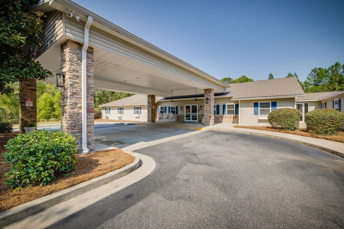 A large building with a parking lot in front of it.