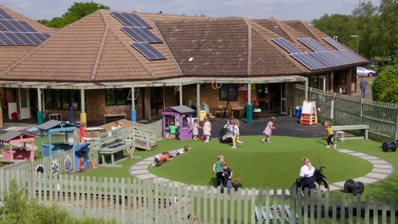 Children enjoying outdoor activities at our nursery in Woking.
