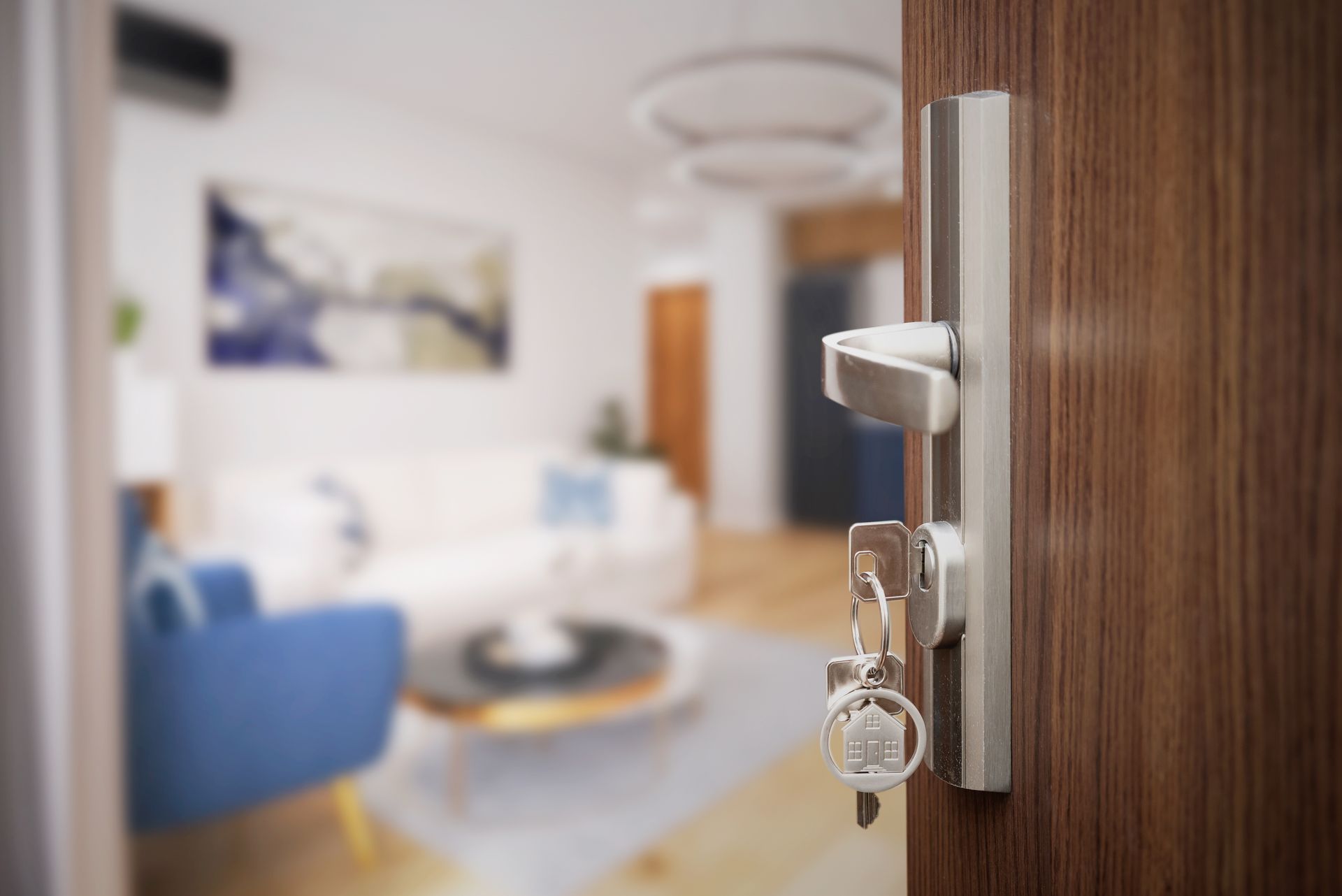 Silver house-shaped key on a set of residential rental property keys. Silver house-shaped key on a set of residential rental property keys.