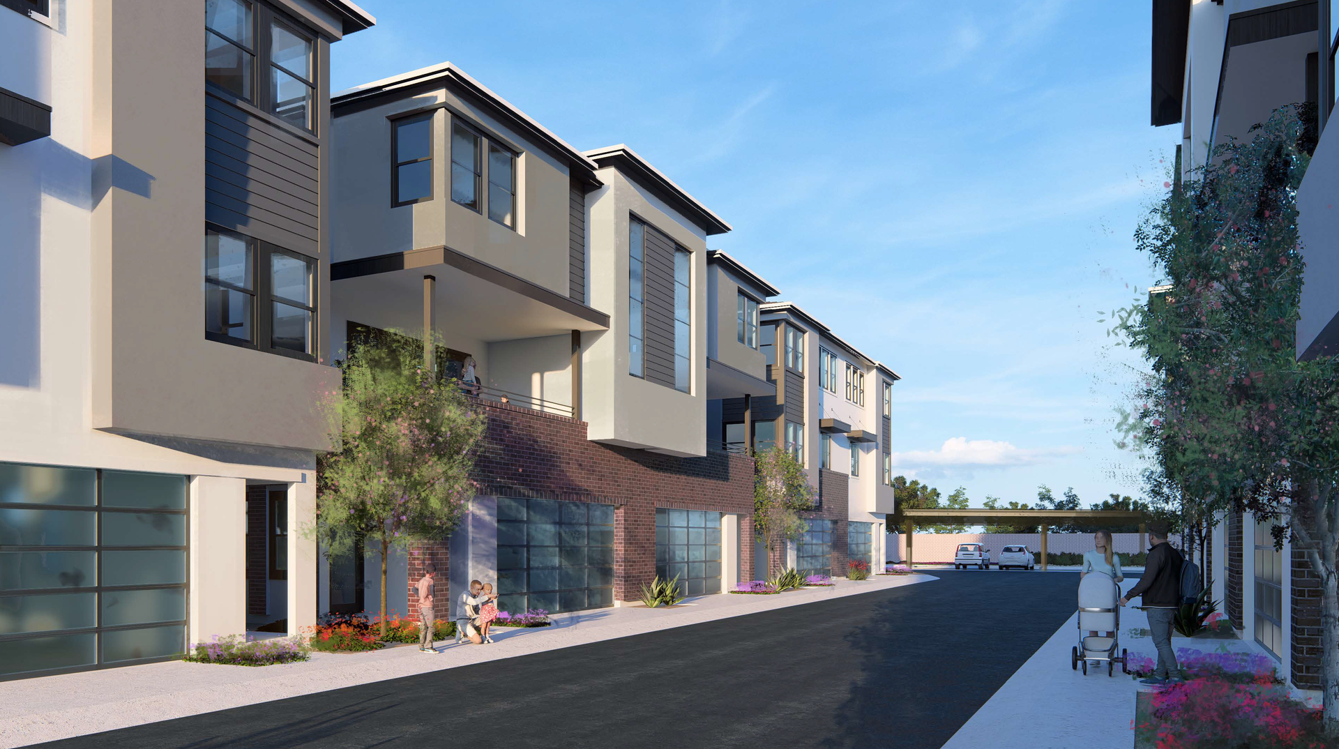 Modern rowhouses along a quiet street under a blue sky, with trees and sidewalk planters