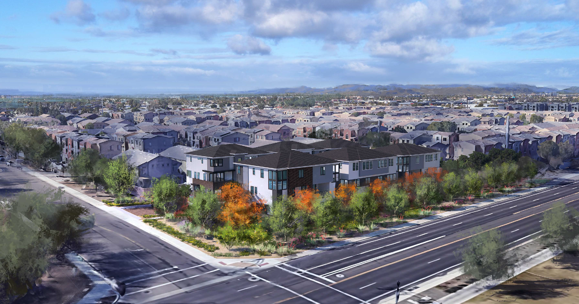 Aerial view of a suburban neighborhood with roads, trees, and distant hills under a clear sky