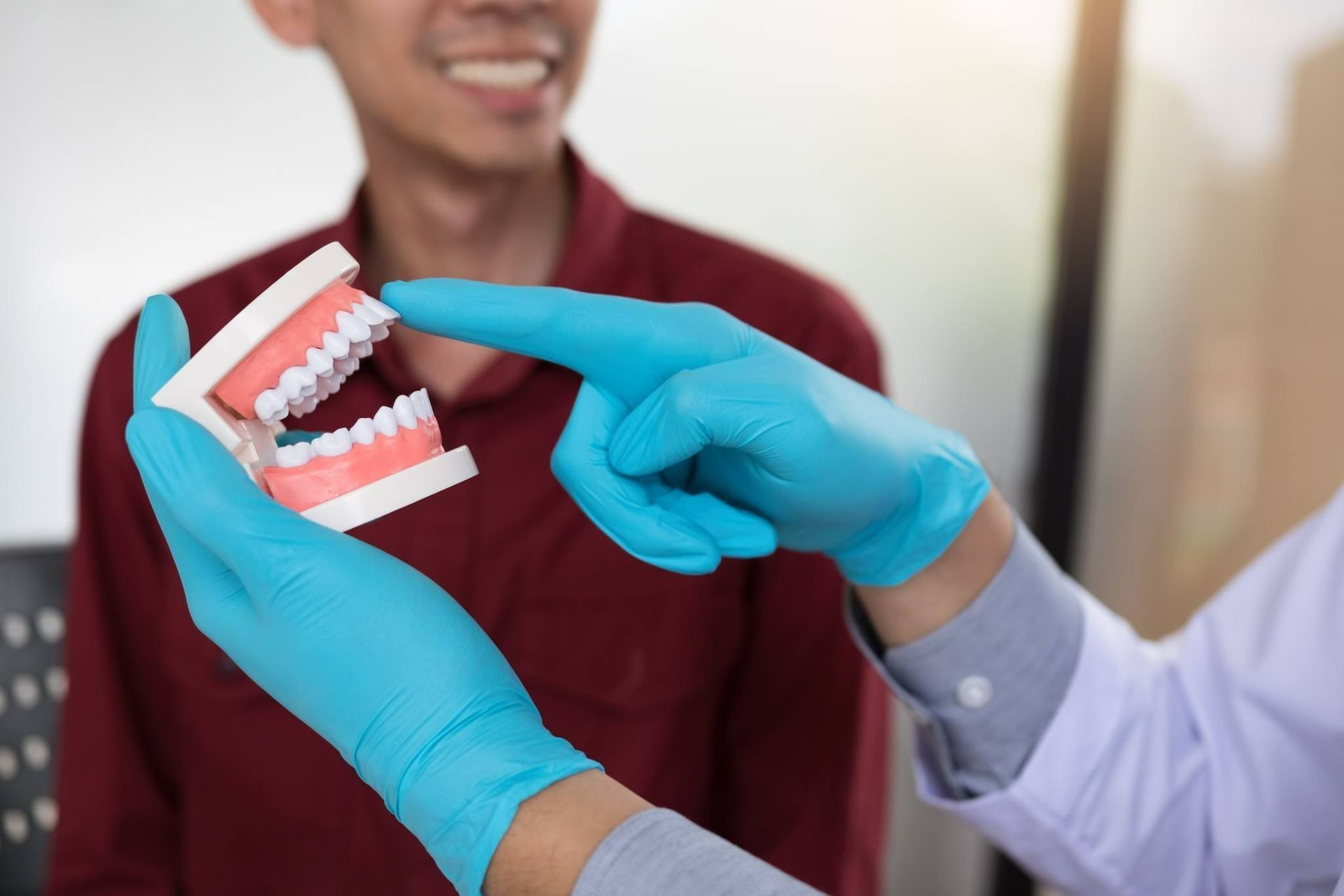 Dentist Educatung A Patient During Dental Check-Up