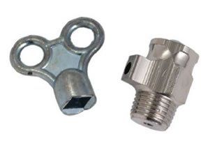 Two metal objects on a white background one of which is a key