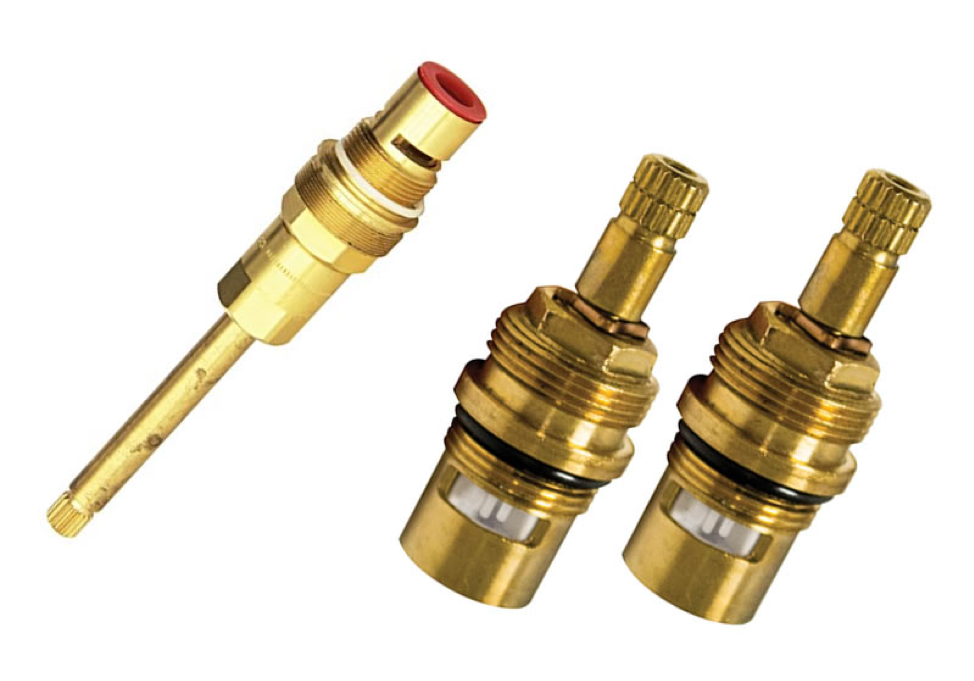 Two brass valves with a red cap on a white background