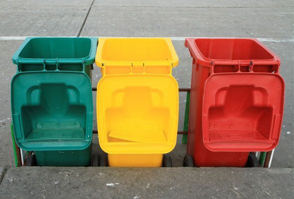 residential trash bins lined up for cleaning service