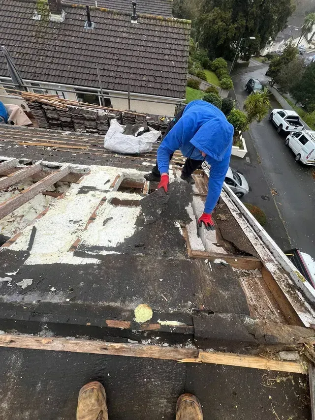 D&R Roofing specialist removing old roofing materials in Wimbledon.