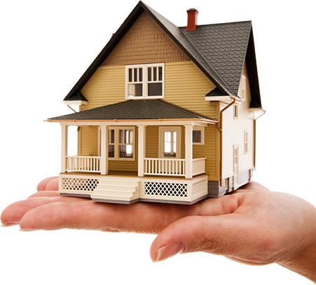 A hand is holding a model house with a porch