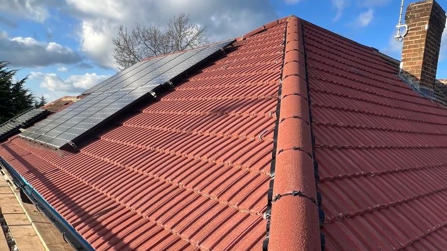 New tiled roof with solar panels installed by a roofer in Wimbledon.