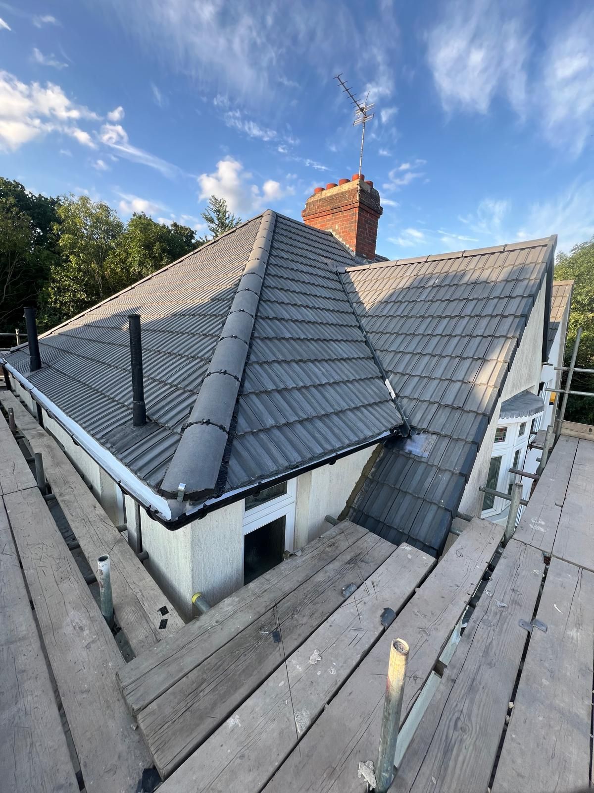 D&R Roofing: Completed grey tiled roof and roofline work in Wimbledon.