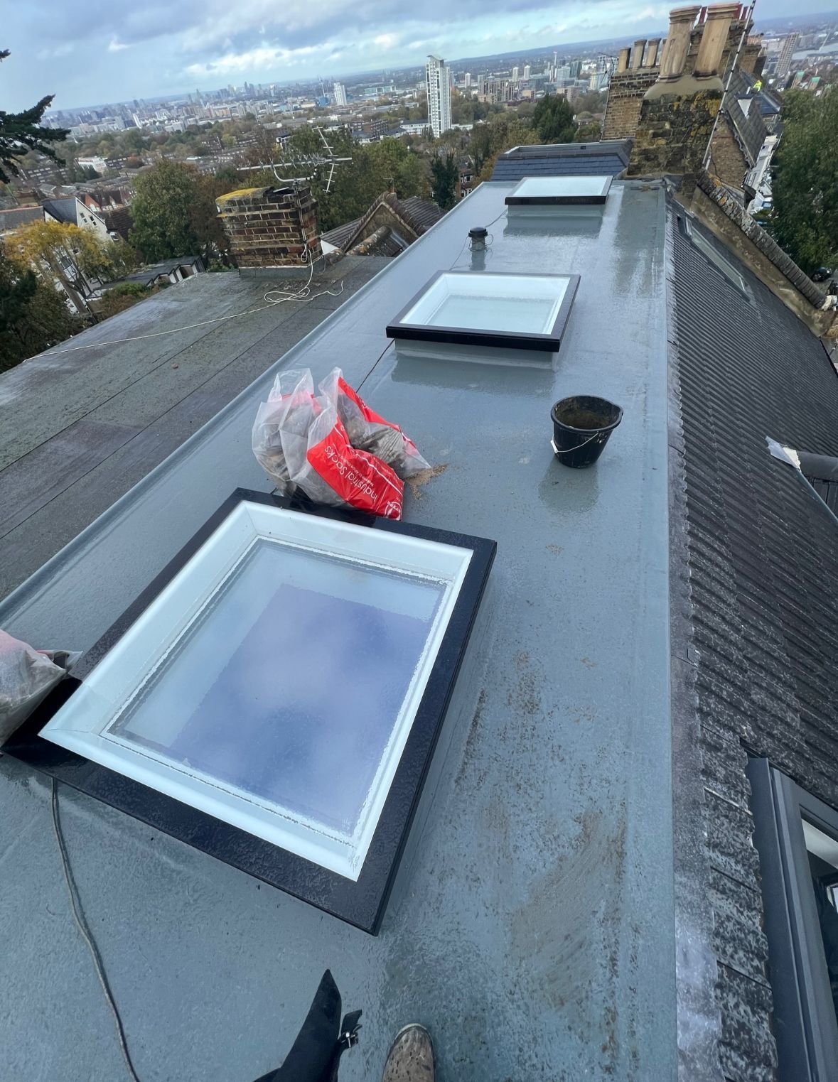 New flat roof and skylight installation by a roofer in Wimbledon.