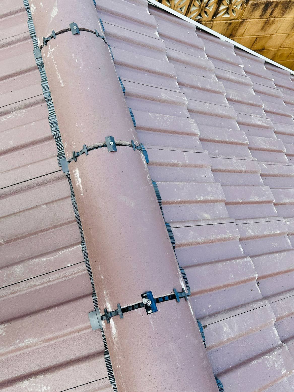 D&R Roofing: Completed tiled roof showing modern ridge capping in Wimbledon.