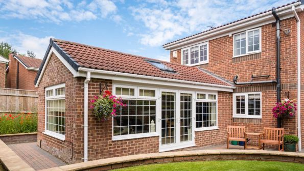 Residential extension in Wimbledon with a new roof, UPVC elements, and integrated gutters by D&R Roofing.