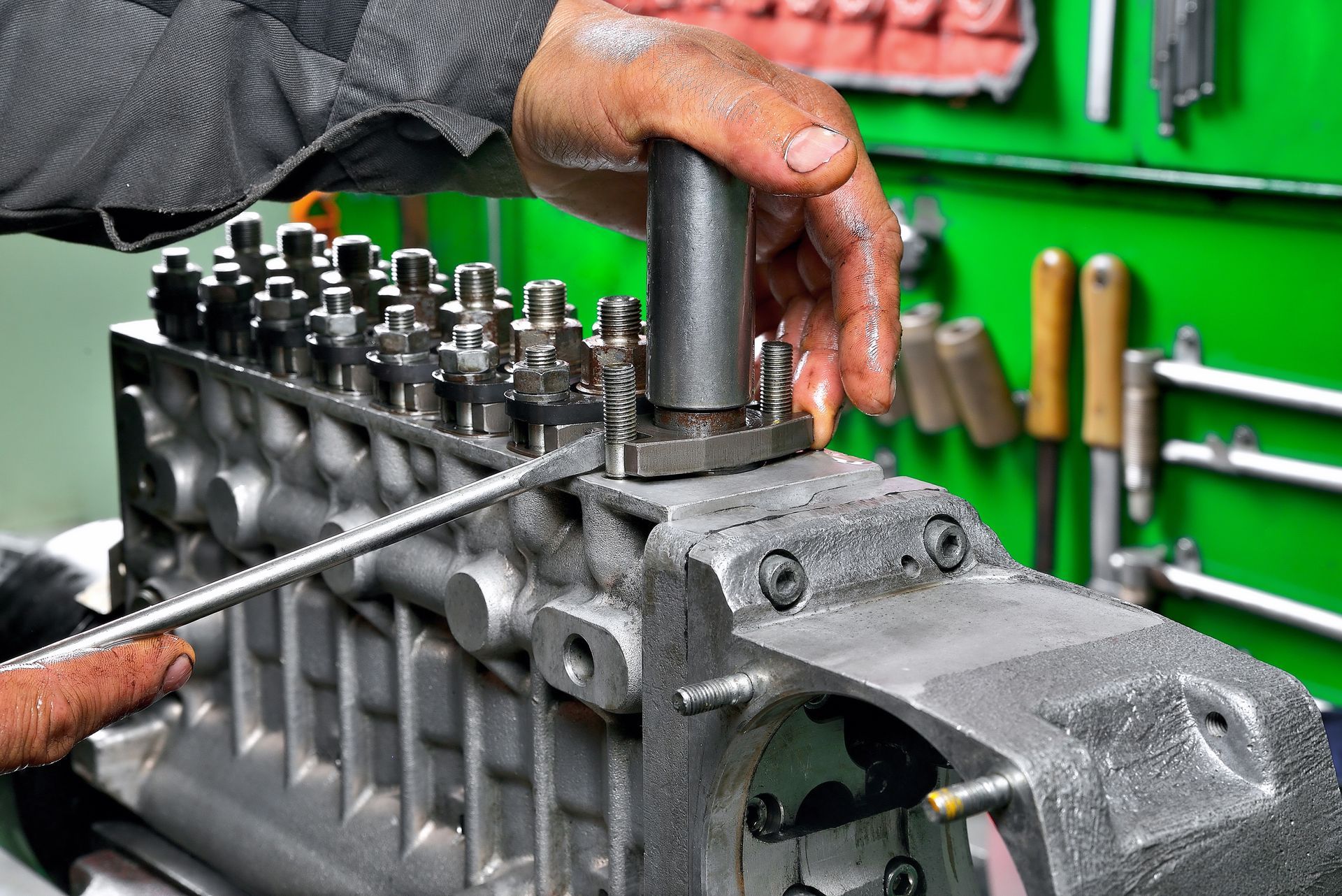 RV diesel engine repair technician servicing an RV engine compartment