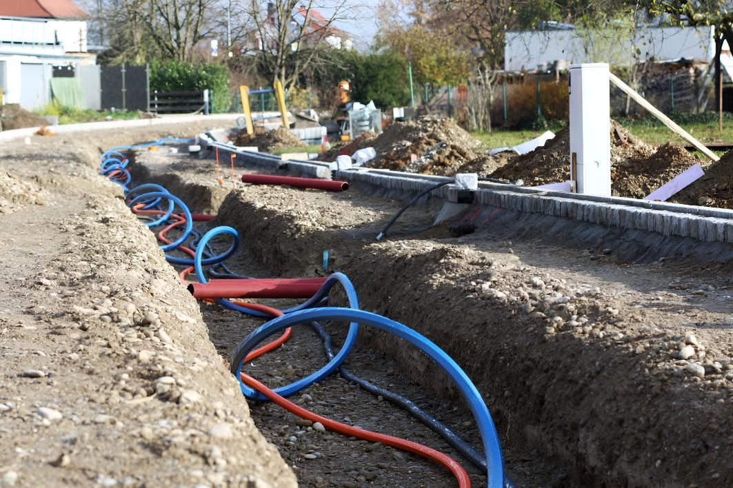 A Bunch Of Pipes Are Laying In The Dirt — State Connect In Bangalow, NSW