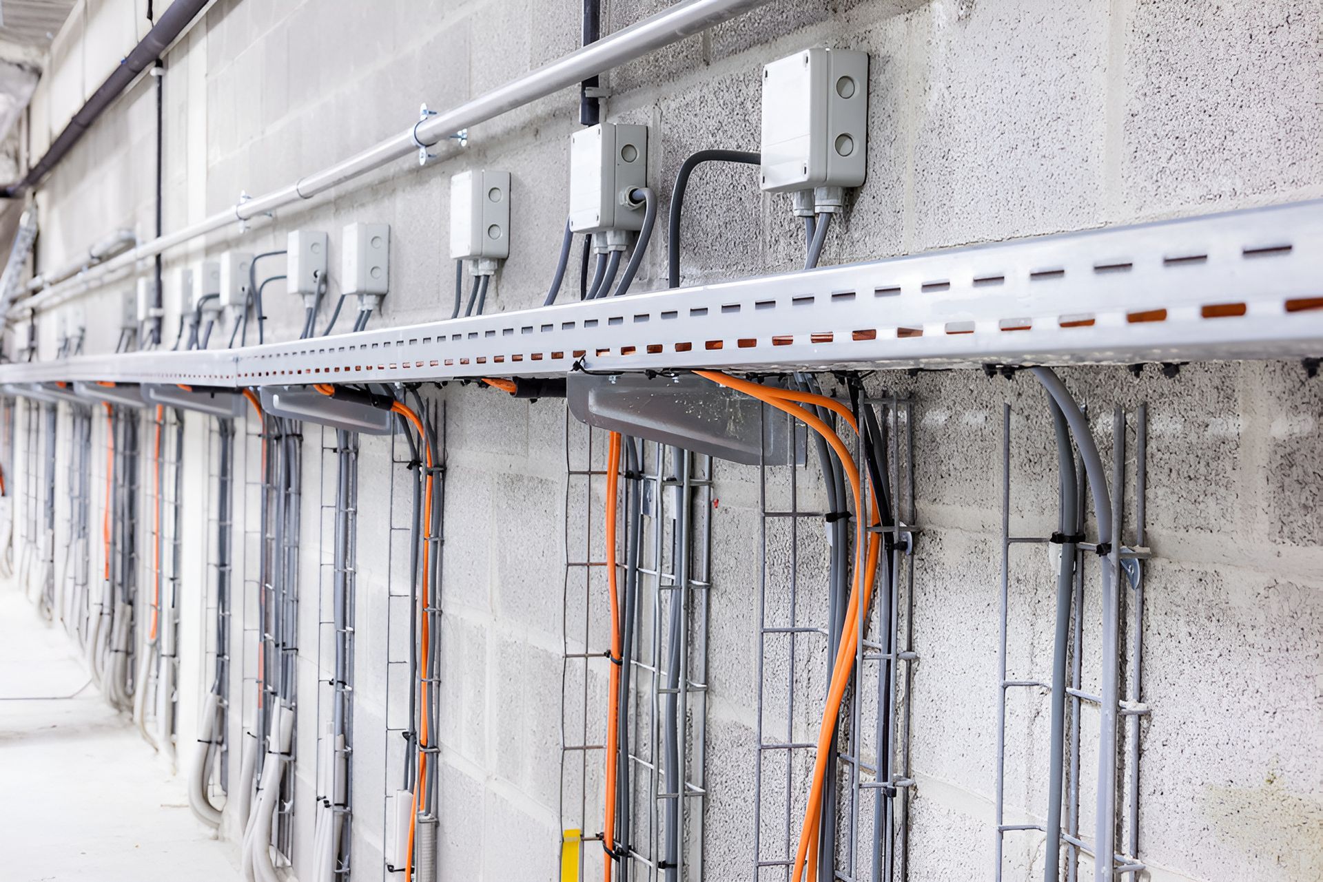 A Row of Electrical Wires Are Hanging on a Wall — State Connect In Bangalow, NSW