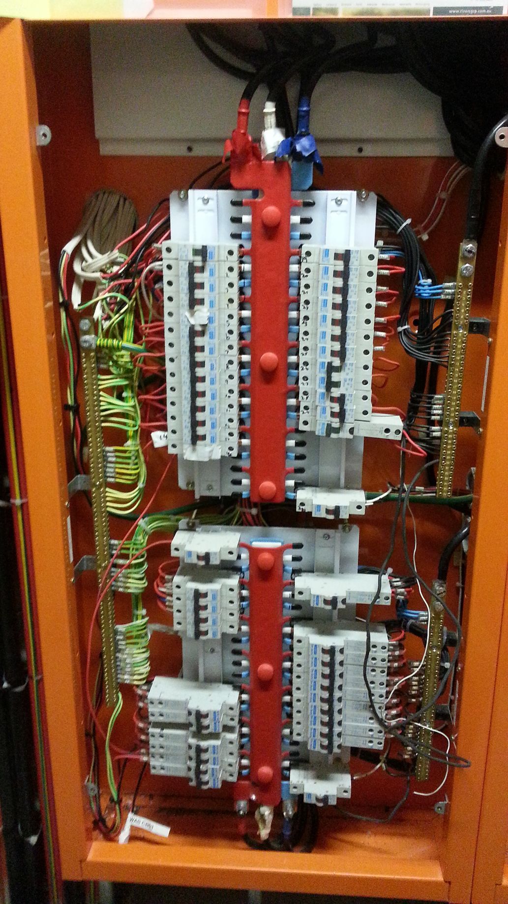 A Person Is Working On An Electrical Box With A Voltmeter — State Connect In Lismore, NSW
