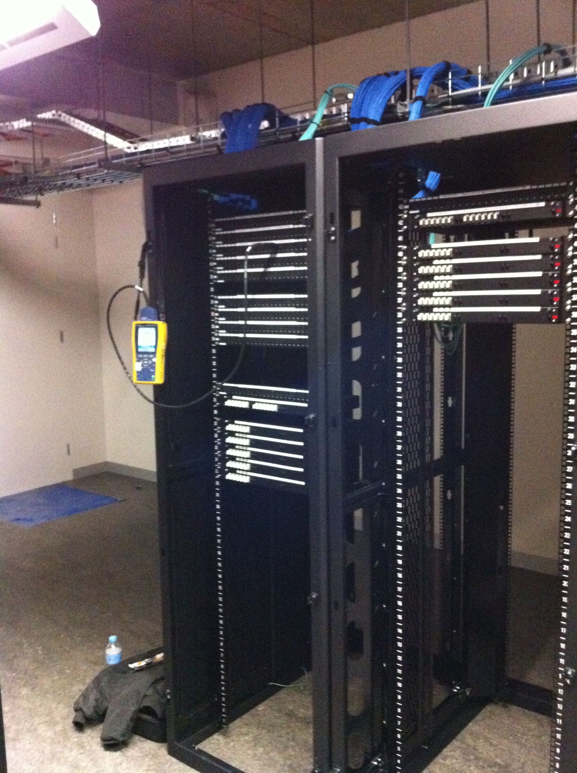 A Server Rack With a Yellow Device Attached to It — State Connect In Pottsville, NSW
