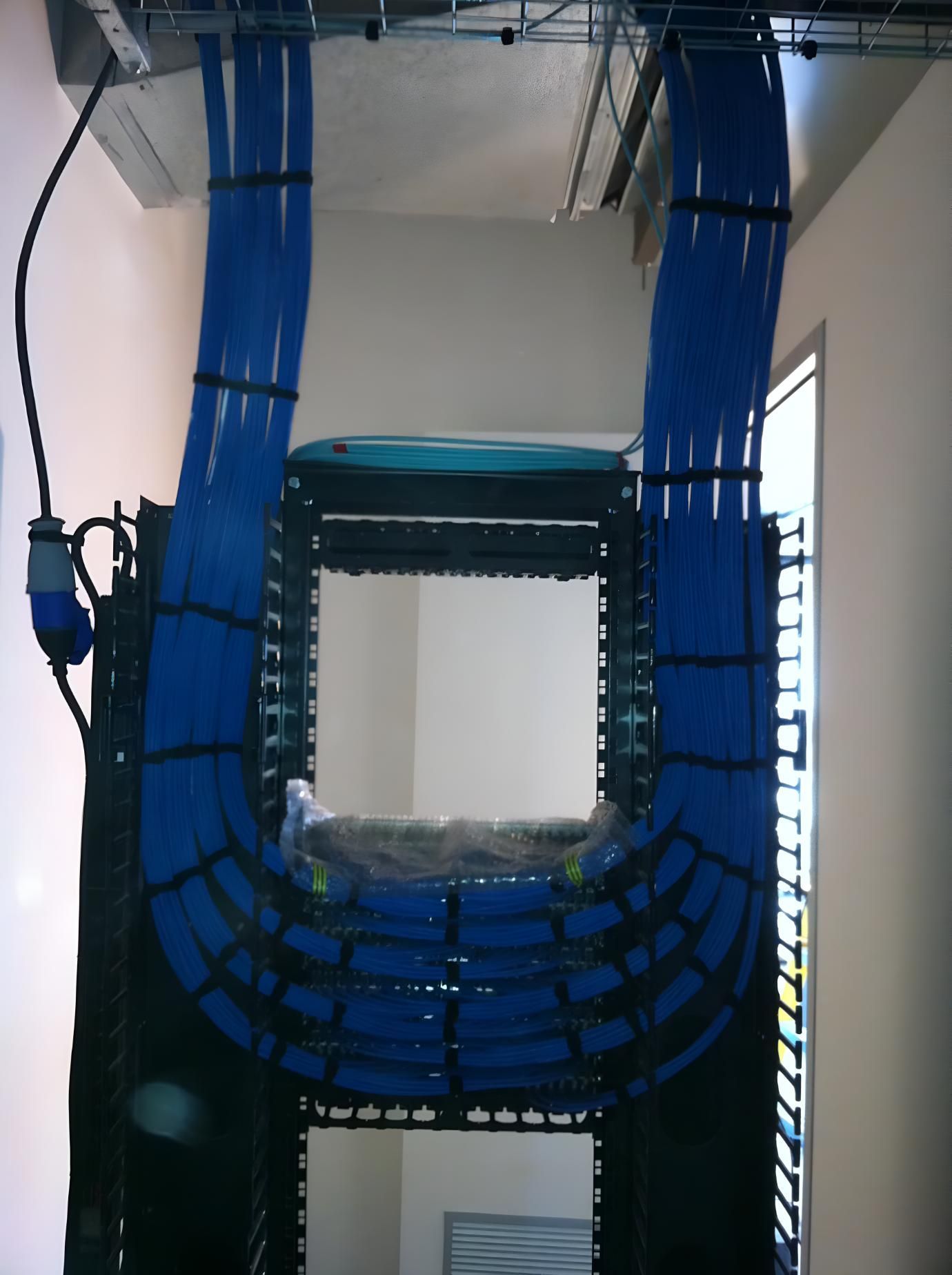 A Bunch Of Blue Wires Are Hanging From The Ceiling — State Connect In Bangalow, NSW
