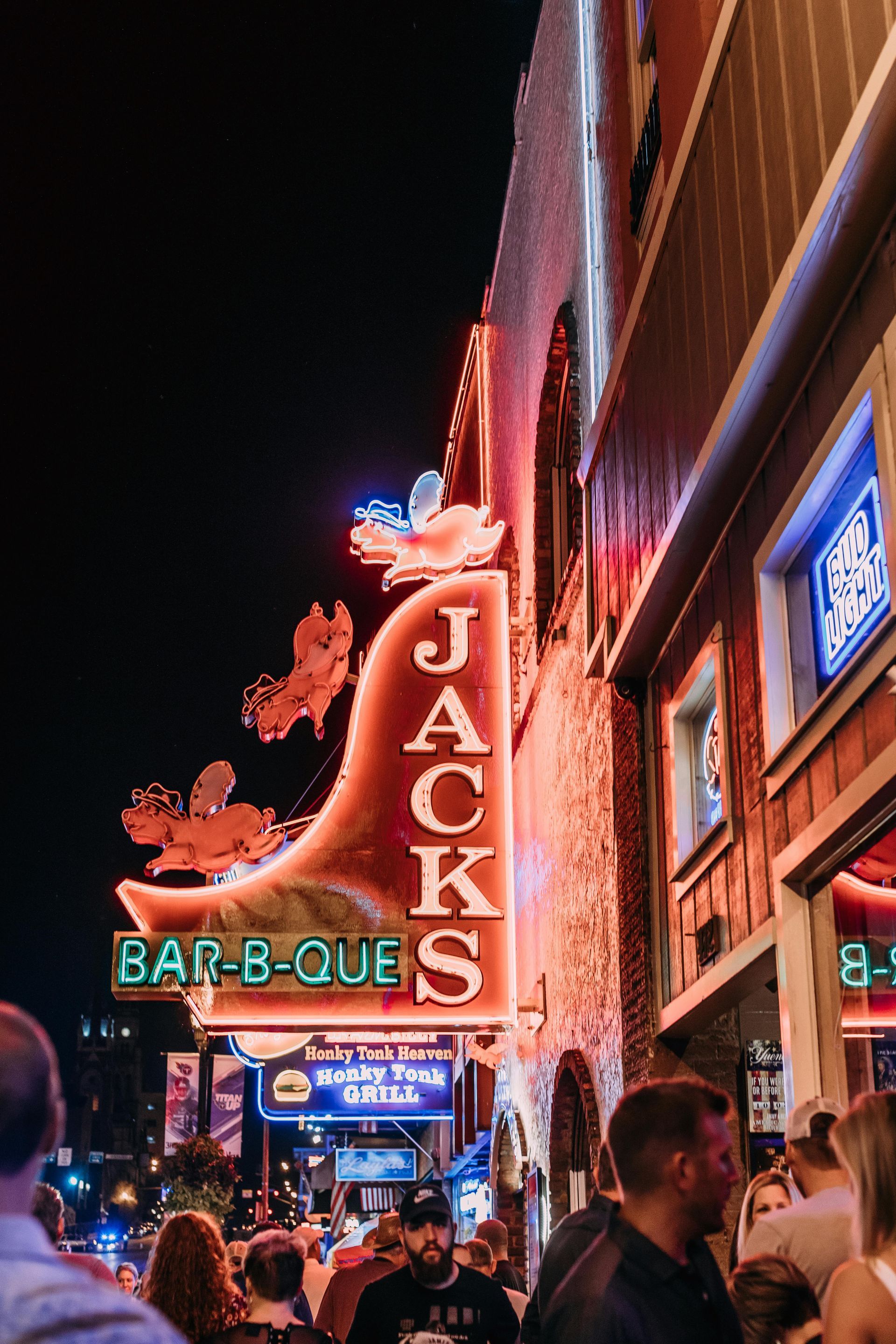 A Neon sign shines for jack 's barbeque. This is a popular food foodie destination in Nashville.
