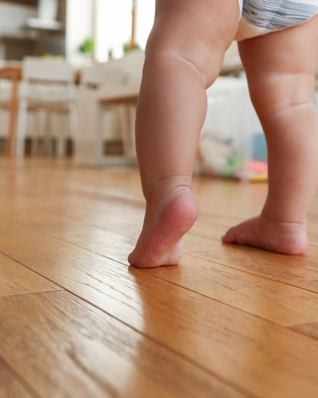 baby taking first step