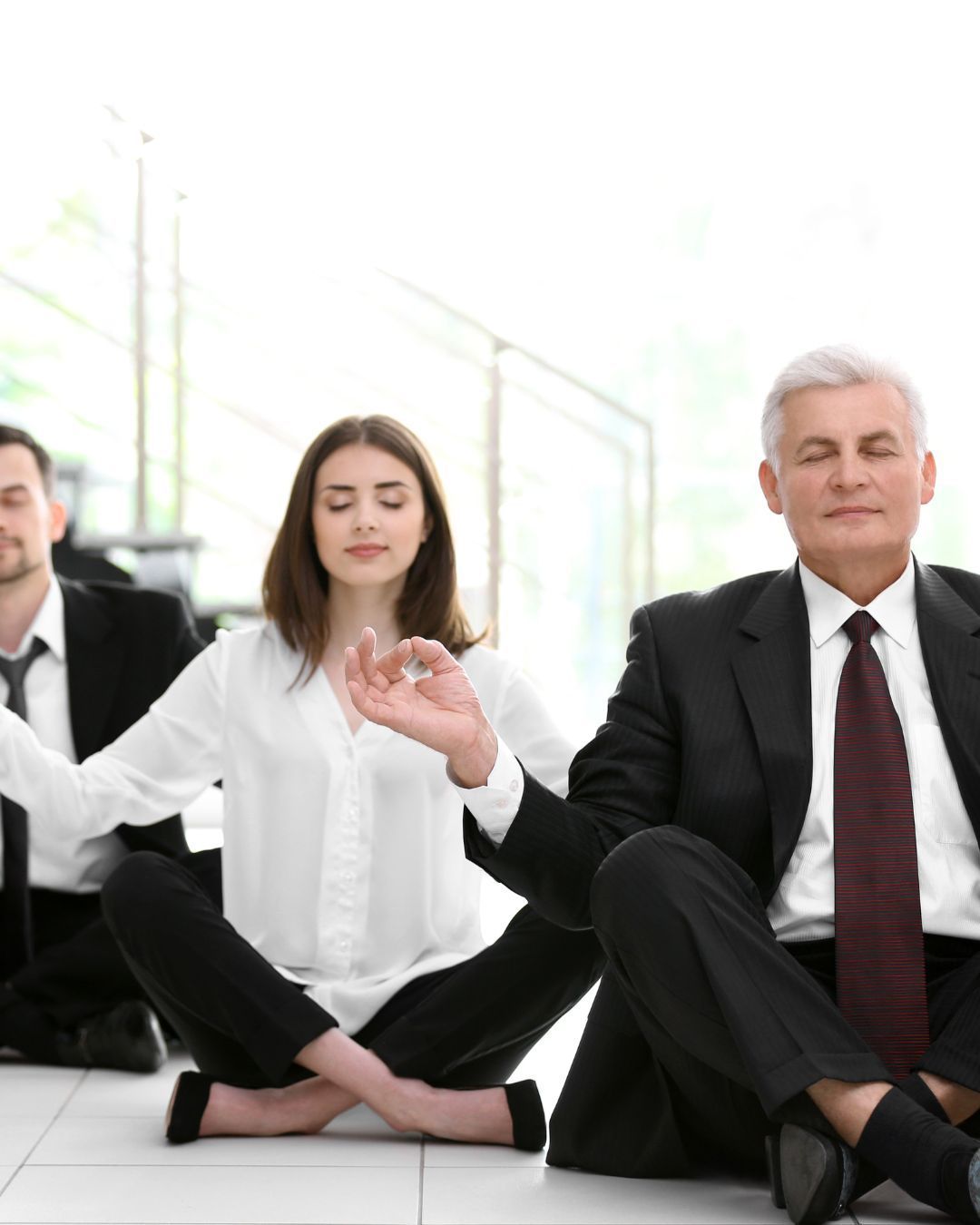 professional man and women meditating