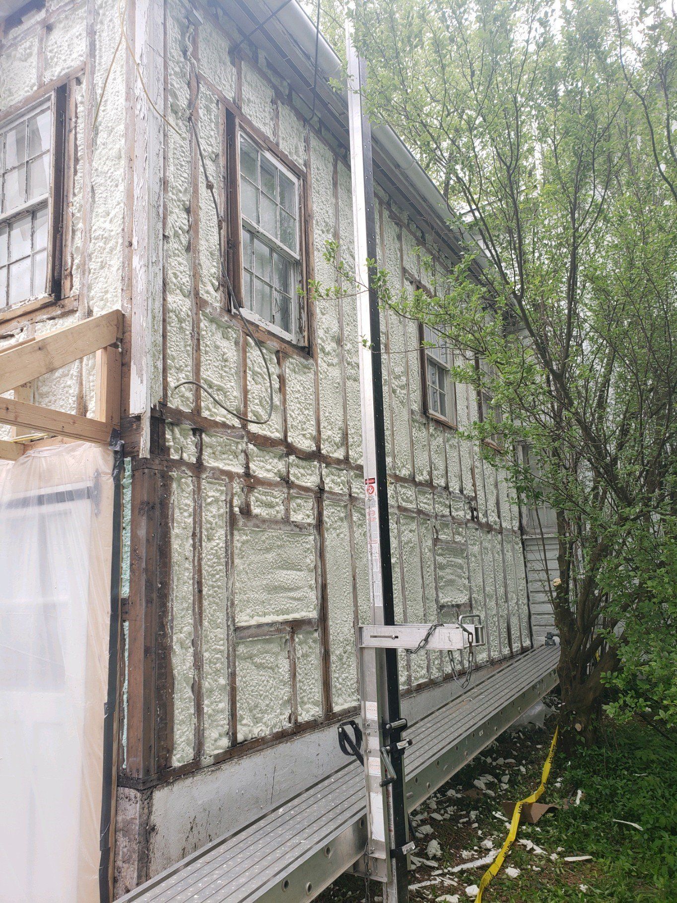 a house with a lot of insulation on the side of it .