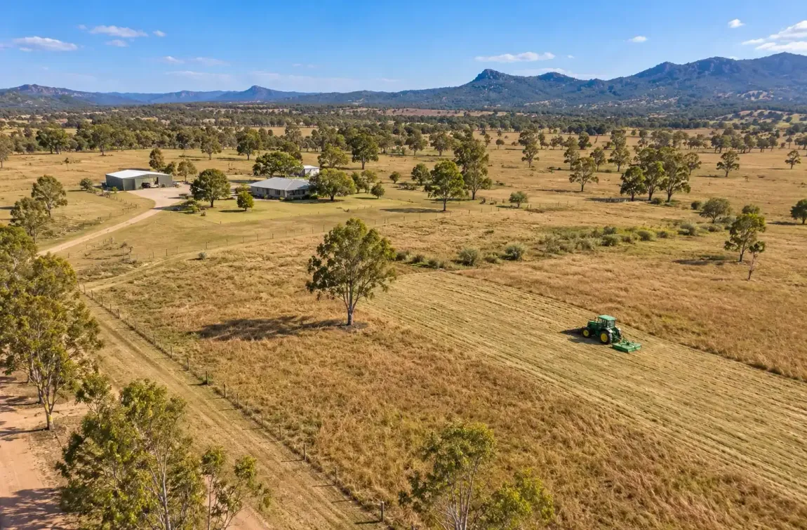 Drone shot of a tractor/slasher combo working on a large rural property near Townsville, QLD