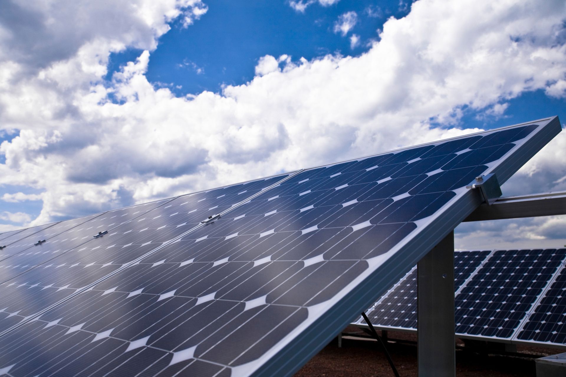 solar panels under cloudscape