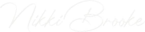 Light gray script logo reading “Nikki Brooke” on a white background