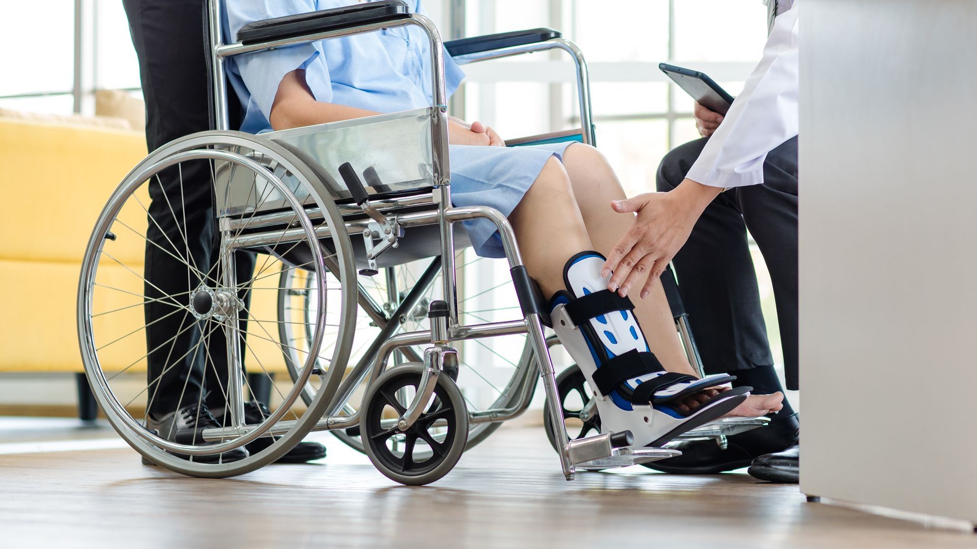 Physiotherapy doctor checking splint leg support to senior old woman. Physiotherapy doctor checking splint leg support to senior old woman.