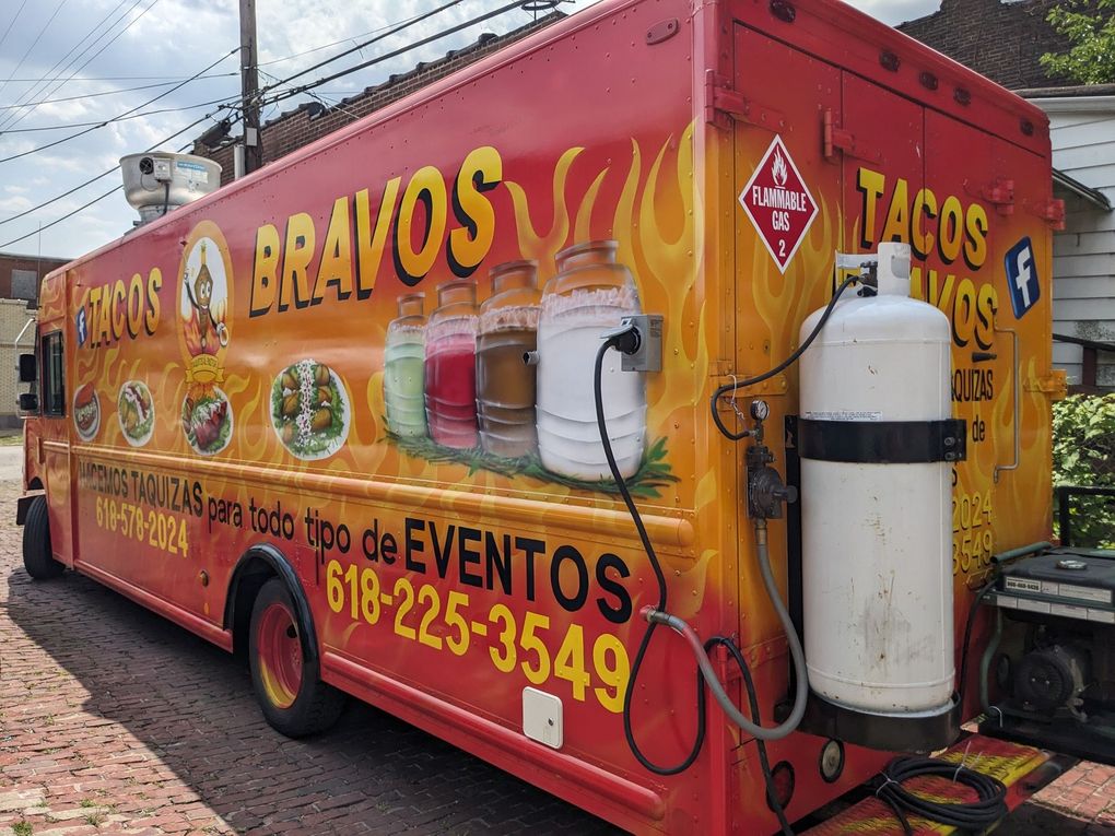 Orange mobile taco truck with