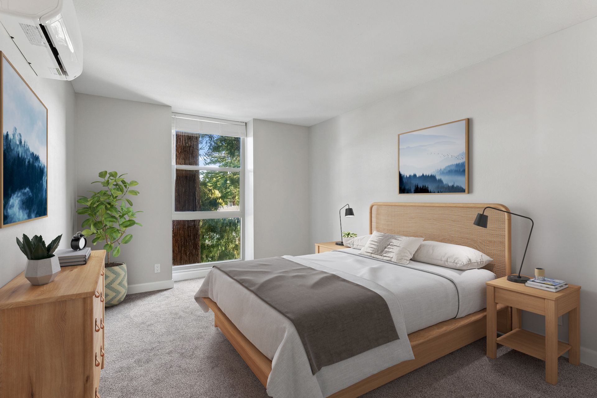 Bright bedroom with a bed, wood dresser, nightstands, and a window with trees outside