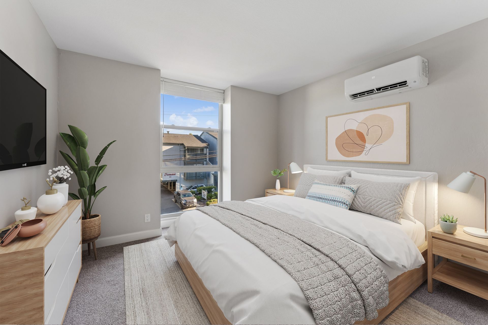 Bright modern bedroom with a made bed, nightstands, wall art, and a window view