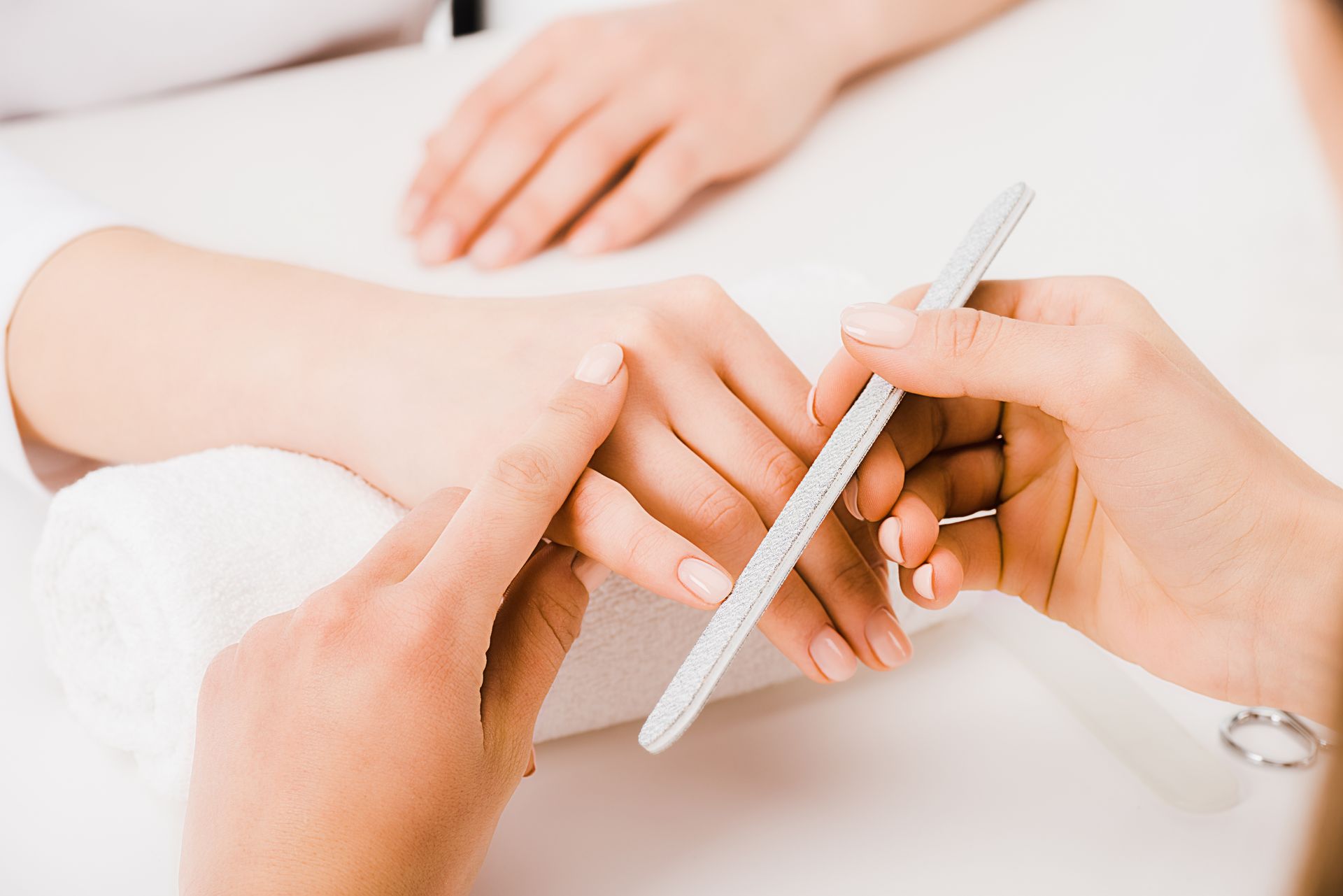 A woman is getting her eyebrows waxed in a beauty salon.