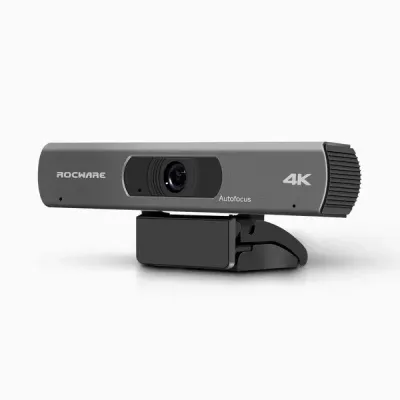Silver and black 4K webcam with autofocus. It has a rectangular body and is mounted on a black stand.