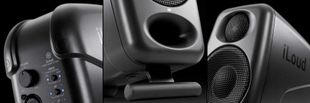 Monitors Close-up of black iLoud studio monitor speakers with volume control knobs.