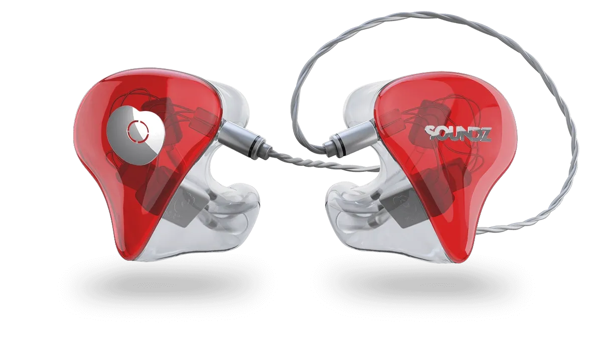 Red and clear in-ear monitors with a heart-shaped design on the left earpiece, connected by a silver cable.