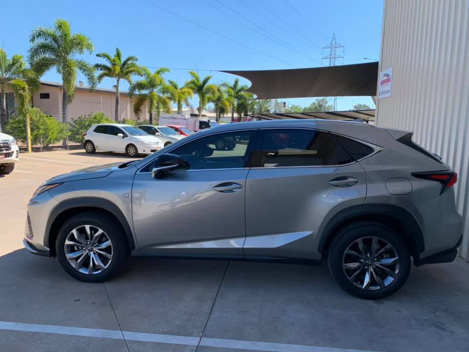 A Silver Lexus Nx is Parked in a Parking Lot Next to a Building — Arafura Crash Repairs in Darwin, NT
