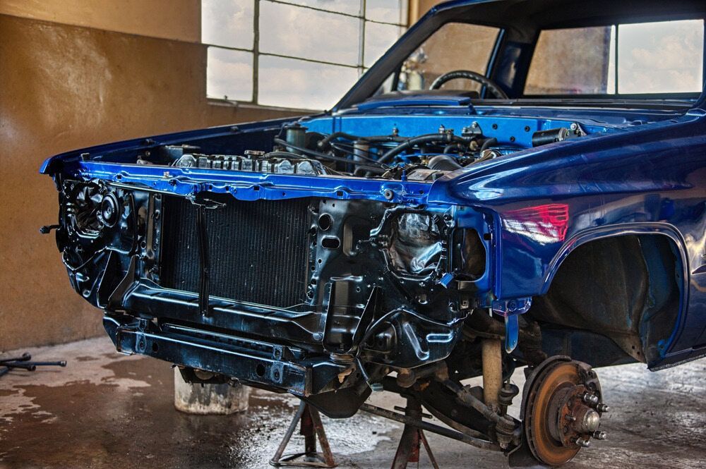 A Blue Car Undergoing Panel Beating — Arafura Crash Repairs in Winnellie, NT