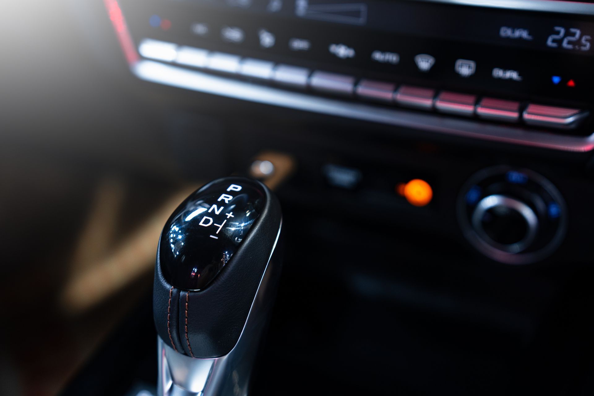 Gear shift in an automatic car, displaying P, R, N, and D.