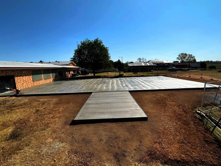 A Concrete Slab in The Middle of A Field — Spencer's Landscape Construction & Concreting Pty Ltd in Dubbo, NSW